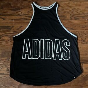 Adidas XL women’s oversized slingshot shirt black and white in color.